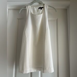 Banana Republic off white tank with racer back detail and slight A line fit.